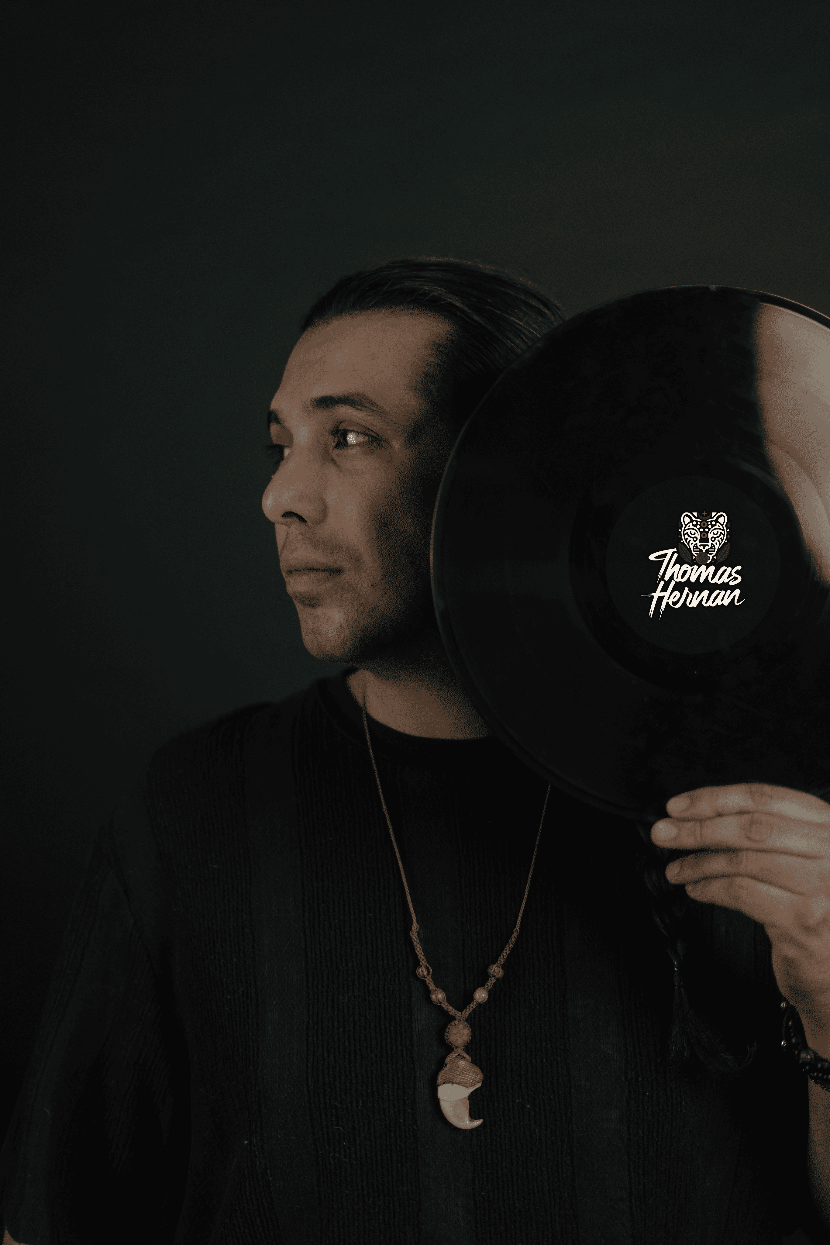 Dj thomas holding a record